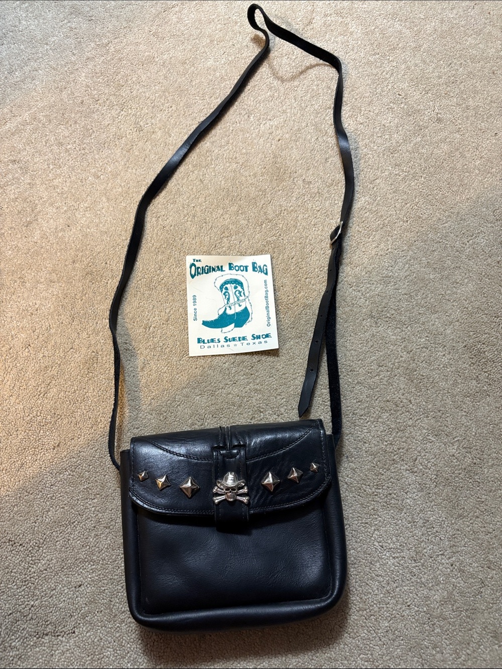 The original boot bag signed black Leather Crossbody Bag Studs and Skull Accent